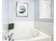 Bright bathroom with soaking tub and modern faucet and tile at 5255 Wildwood Way, Davenport, FL 33837