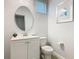 Half bathroom featuring a decorative mirror and a modern toilet at 5255 Wildwood Way, Davenport, FL 33837