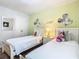 Charming bedroom with twin beds and cheerful Mickey Mouse decor at 5255 Wildwood Way, Davenport, FL 33837