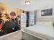 Comfortable bedroom with painted wall, creating a relaxing retreat at 5255 Wildwood Way, Davenport, FL 33837