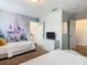 Charming bedroom featuring twin beds and a vibrant fairytale-themed mural at 5255 Wildwood Way, Davenport, FL 33837