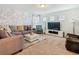 Spacious living room featuring custom Mickey Mouse mural, comfortable seating, and modern lighting at 5255 Wildwood Way, Davenport, FL 33837