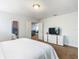 A bright main bedroom with view to sitting room and modern white dresser at 5255 Wildwood Way, Davenport, FL 33837