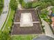 Aerial shot of a sand volleyball court, featuring well-maintained landscaping and conveniently located near residential areas at 5255 Wildwood Way, Davenport, FL 33837