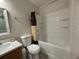 Bathroom with shower and tub combo, white fixtures, and modern vanity at 5515 Paradise Cay Cir, Kissimmee, FL 34746