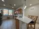 Modern kitchen features an island with barstool seating, stainless steel appliances, and ample counter space at 5515 Paradise Cay Cir, Kissimmee, FL 34746