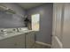 Functional laundry room with modern washer and dryer, shelving, and a window for ventilation at 5515 Paradise Cay Cir, Kissimmee, FL 34746
