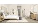 Beautifully staged bedroom with neutral colors, natural light, modern furniture and decor at 5656 Vinyasa Rd, Clermont, FL 34714