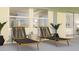 Outdoor patio area with lounge chairs, offering a relaxing space for outdoor living at 5656 Vinyasa Rd, Clermont, FL 34714
