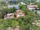 Aerial view showcasing a charming residential neighborhood with lush trees and unique rooftop patios at 602 E Livingston St # 3, Orlando, FL 32803