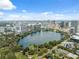 Stunning aerial view of Lake Eola and the Orlando skyline, with lush greenery and clear blue skies at 602 E Livingston St # 3, Orlando, FL 32803