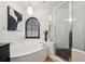 Corner bathtub, glass-enclosed shower and modern fixtures make this bathroom a spa-like retreat at 602 E Livingston St # 3, Orlando, FL 32803