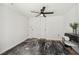 Neutral bedroom featuring a ceiling fan, double closet, and a stylish rug over ceramic tile at 602 E Livingston St # 3, Orlando, FL 32803