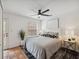 Bedroom features a ceiling fan, modern decor, white walls, and lots of natural light at 602 E Livingston St # 3, Orlando, FL 32803