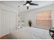 Bright bedroom with white walls, ceiling fan, and sliding glass doors to the outdoors at 602 E Livingston St # 3, Orlando, FL 32803