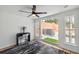 Bright bedroom with a modern desk, chair and large sliding glass doors to a private patio at 602 E Livingston St # 3, Orlando, FL 32803