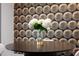 Elegant black dining room table with a bouquet of white hydrangeas sits against patterned wallpaper at 602 E Livingston St # 3, Orlando, FL 32803