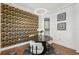 Stylish dining room with decorative black and gold wallpaper and round table with modern light fixture at 602 E Livingston St # 3, Orlando, FL 32803