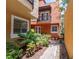 Charming two-story condo building with a small balcony and landscaped grounds at 602 E Livingston St # 3, Orlando, FL 32803