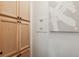 Hallway area with built in cabinet, artwork, and neutral color palette at 602 E Livingston St # 3, Orlando, FL 32803