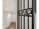 Hallway with custom iron decor piece and a view into additional space at 602 E Livingston St # 3, Orlando, FL 32803