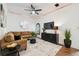 Comfortable living room featuring a sectional sofa, modern decor, and a ceiling fan at 602 E Livingston St # 3, Orlando, FL 32803