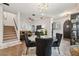 Open living space featuring modern lighting, staircase, and sophisticated decor elements at 602 E Livingston St # 3, Orlando, FL 32803