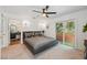 Cozy main bedroom with an en-suite bath and access to a private balcony with a view at 602 E Livingston St # 3, Orlando, FL 32803