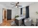 Bright home office with black ceiling fan, neutral walls, gray rug, and stylish desk at 602 E Livingston St # 3, Orlando, FL 32803