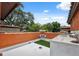 Orange stucco wall with outdoor kitchen on a roof deck at 602 E Livingston St # 3, Orlando, FL 32803