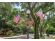 Historic Lake Eola Heights district street sign with American flags on a tree-lined street at 602 E Livingston St # 3, Orlando, FL 32803