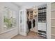 Well-organized walk-in closet with custom shelving, storage and a window with lots of light at 602 E Livingston St # 3, Orlando, FL 32803