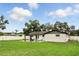 This sprawling backyard offers a paved patio with a gazebo, a level lawn, and a stylish exterior at 7307 Grace Rd, Orlando, FL 32819