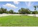 Large, well-maintained backyard with lush green grass and a white fence at 7307 Grace Rd, Orlando, FL 32819