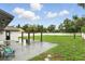 Spacious backyard with a gazebo, white fence and string lights perfect for entertaining at 7307 Grace Rd, Orlando, FL 32819