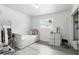 Bright bedroom featuring wood-look floors, white walls and trim, a pullout bed and window at 7307 Grace Rd, Orlando, FL 32819