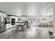 Modern kitchen with stainless steel appliances, white cabinets, and a kitchen island with seating at 7307 Grace Rd, Orlando, FL 32819