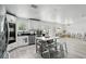 Bright kitchen featuring white cabinetry, stainless steel appliances, and an island with seating at 7307 Grace Rd, Orlando, FL 32819