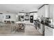 A contemporary kitchen featuring sleek white cabinetry, stainless steel appliances and a center island at 7307 Grace Rd, Orlando, FL 32819