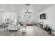Spacious living room with hardwood floors, neutral furnishings, and ample natural light at 7307 Grace Rd, Orlando, FL 32819