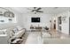 Bright living room with stylish decor, hardwood flooring, and large windows at 7307 Grace Rd, Orlando, FL 32819