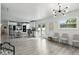 Open concept living space featuring modern lighting, kitchen and seating area at 7307 Grace Rd, Orlando, FL 32819