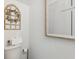 Elegant powder room featuring toilet and stylish decor, creating a serene space at 746 Longboat Dr, Davenport, FL 33896