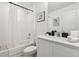 Cozy bathroom showcasing a tub and shower with a framed mirror over the vanity at 746 Longboat Dr, Davenport, FL 33896