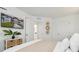 Bright bedroom featuring woven basket accents, TV, and ample storage with clean and minimalist style at 746 Longboat Dr, Davenport, FL 33896
