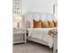 Elegant bedroom showcasing a comfortable bed, a nightstand, and soft lighting at 746 Longboat Dr, Davenport, FL 33896