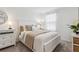 Cozy bedroom with neutral tones, dresser, window with blinds, and soft carpeting at 746 Longboat Dr, Davenport, FL 33896