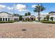 Beautifully designed community center with manicured grounds, brick-paved walkways, and an inviting atmosphere at 746 Longboat Dr, Davenport, FL 33896