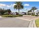 Attractive community entrance featuring lush landscaping, signage, and palm trees showcasing community pride at 746 Longboat Dr, Davenport, FL 33896