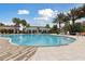 Resort-style pool featuring a spacious deck, comfortable seating, and clear blue water for enjoyment at 746 Longboat Dr, Davenport, FL 33896
